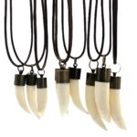 Genuine saltwater crocodile tooth pendant hanging from adjustable leather cord