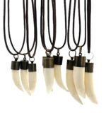 Genuine saltwater crocodile tooth pendant hanging from adjustable leather cord